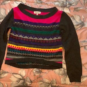 A gray colorful sweater